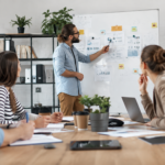 Marketing agency team collaborating on a digital marketing strategy during a meeting in a modern office.